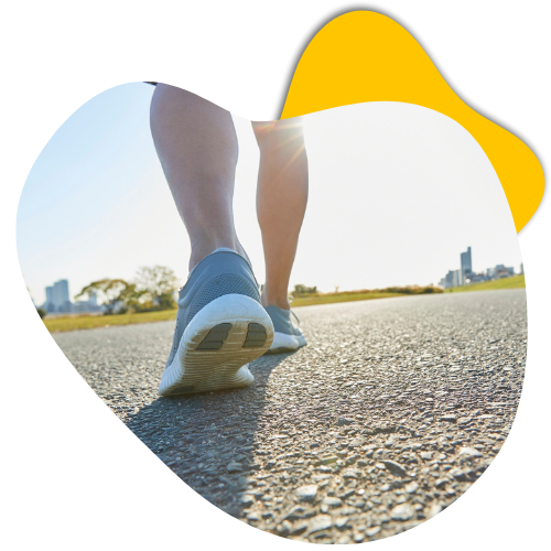 Person walking on a pathway in athletic shoes, emphasizing foot health and mobility, relevant to podiatry imaging services at Life Medical Imaging.
