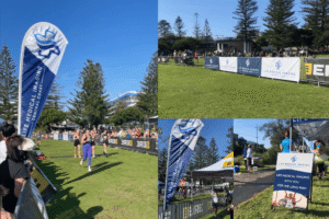 Life Medical Imaging sponsorship banner at Central Coast Run Fest, participants running, community event atmosphere, promoting health and wellbeing.