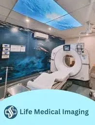 CT scan room with medical equipment and a calming ceiling design.