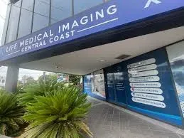 Medical imaging center exterior with signage and greenery.